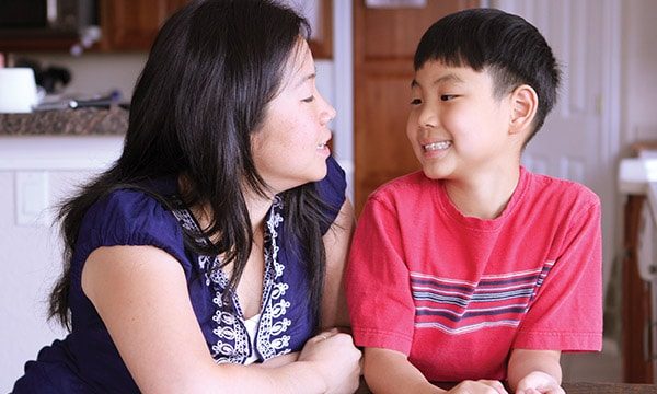Mom and Son in Kitchen Talking