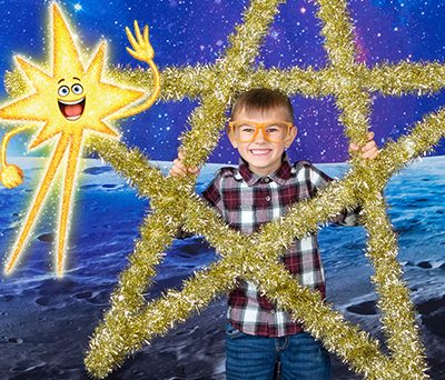 Boy holding a large star