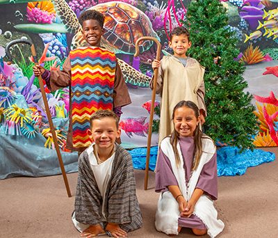 four kids dressed as shepherds