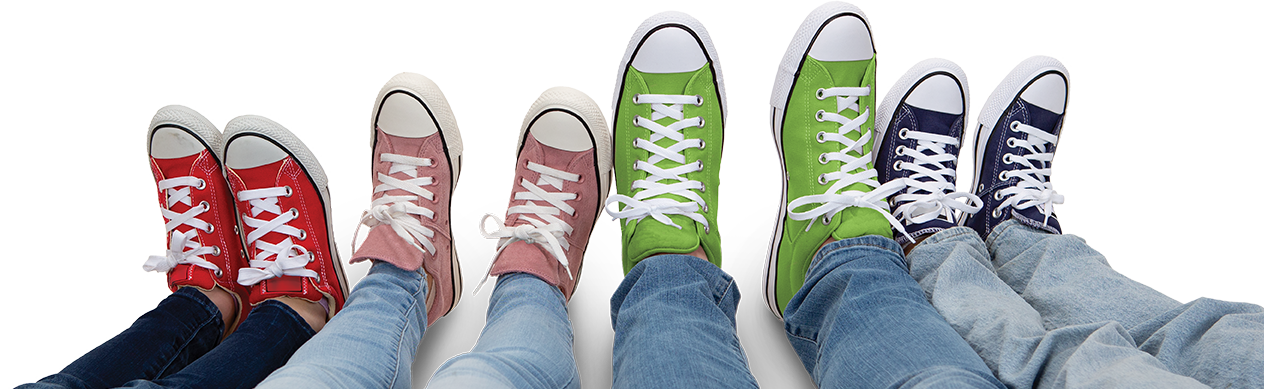 family of four laying down with sneakers on