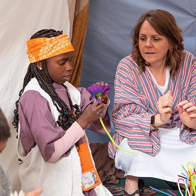 VBS leader interacting with child