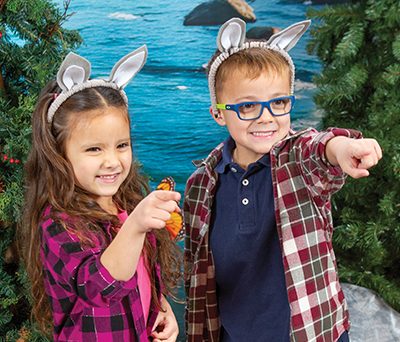Two preschoolers smiling and pointing