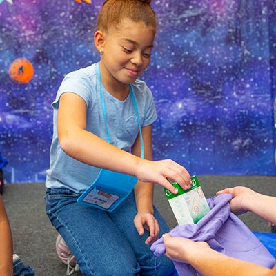 Kid doing a project at Galaxy Weekend VBS 2026