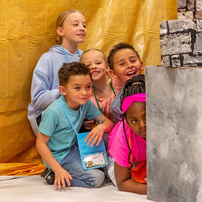 VBS Students Hiding Behind Blocks
