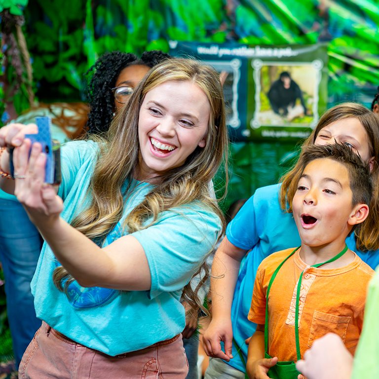 VBS leader taking selfie with kids