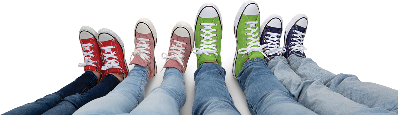 Family showing their shoes in a row