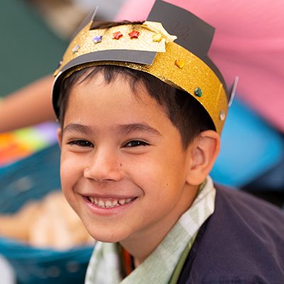 Child with a crown in his head