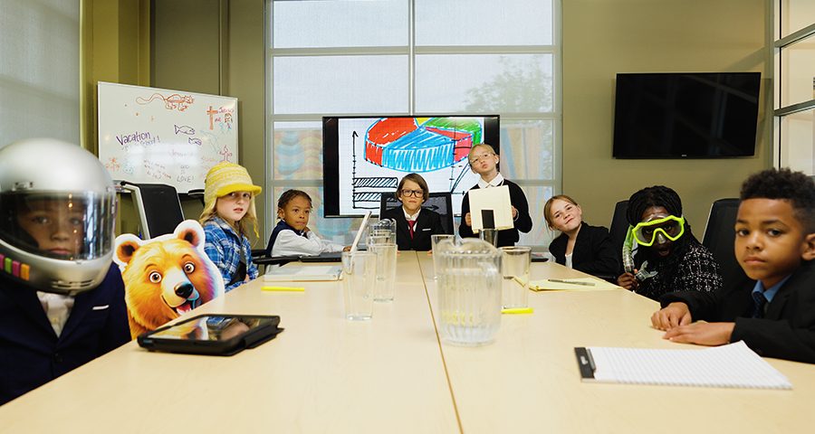2027 VBS Kid Consultants sitting at executive table