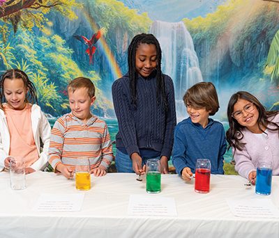 Kids doing an experiment at a table